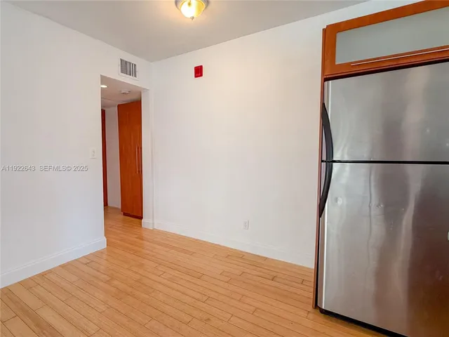 a view of a bathroom from a hallway