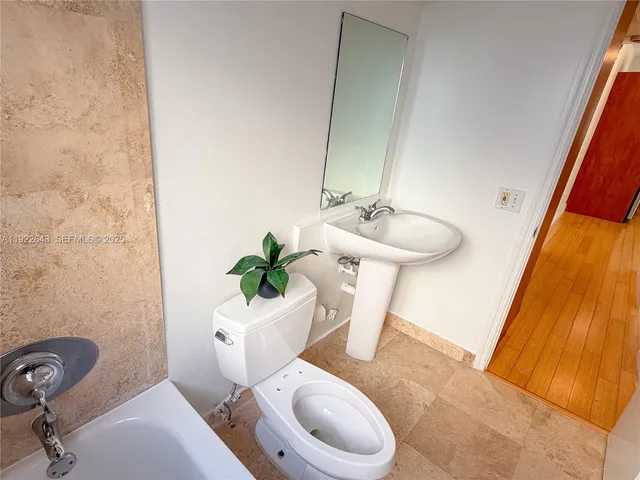 a view of a bathroom with a hallway