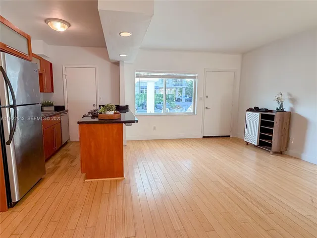 a spacious bathroom with a sink and a mirror