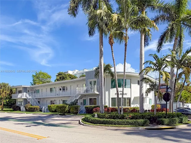 front view of a building with a garden