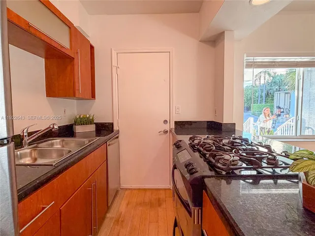 a kitchen with a stove and a microwave