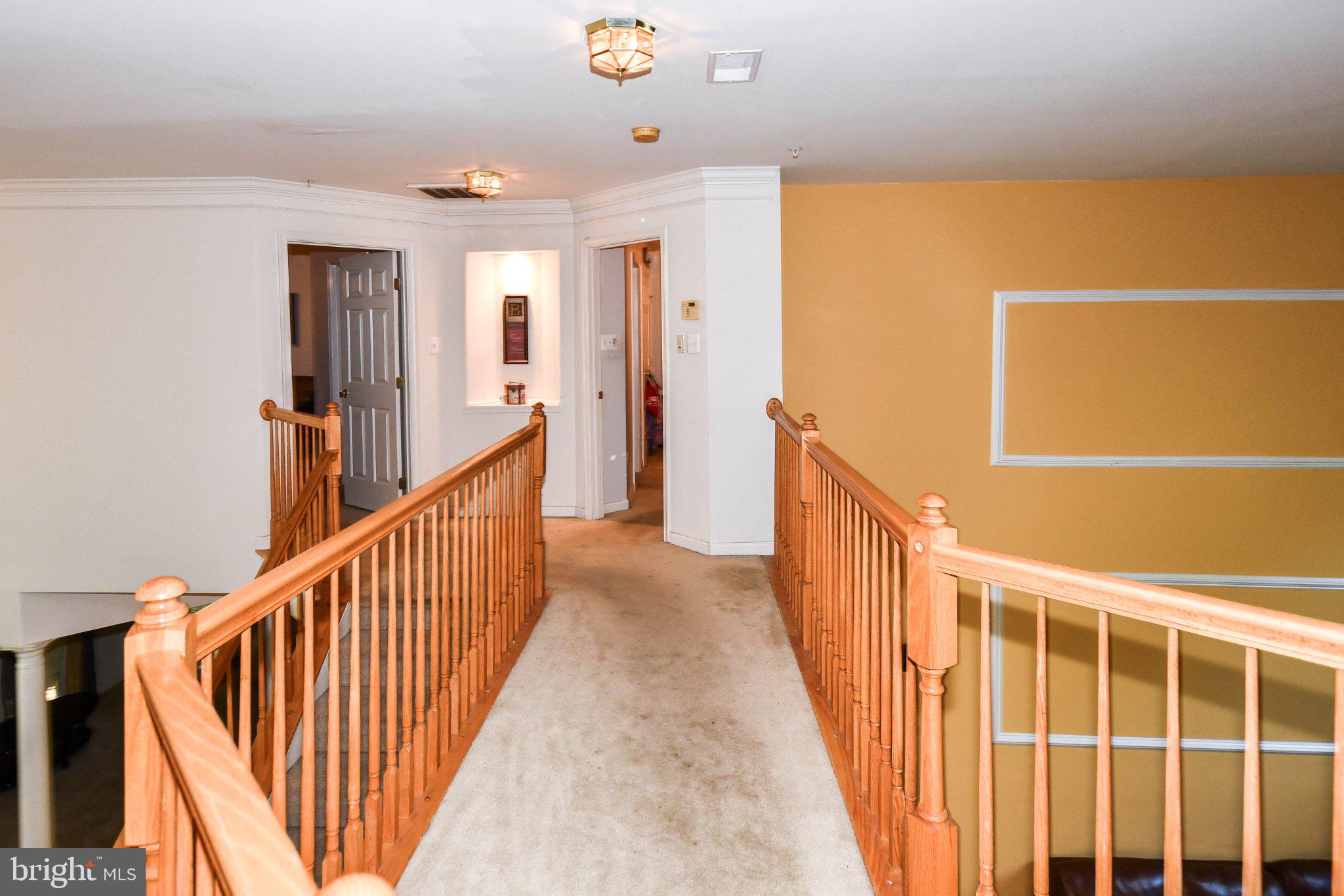 3208 Clavier Place Clinton, MD 20735 - Photo 53 of 55 Inviting hallway with warm tones.