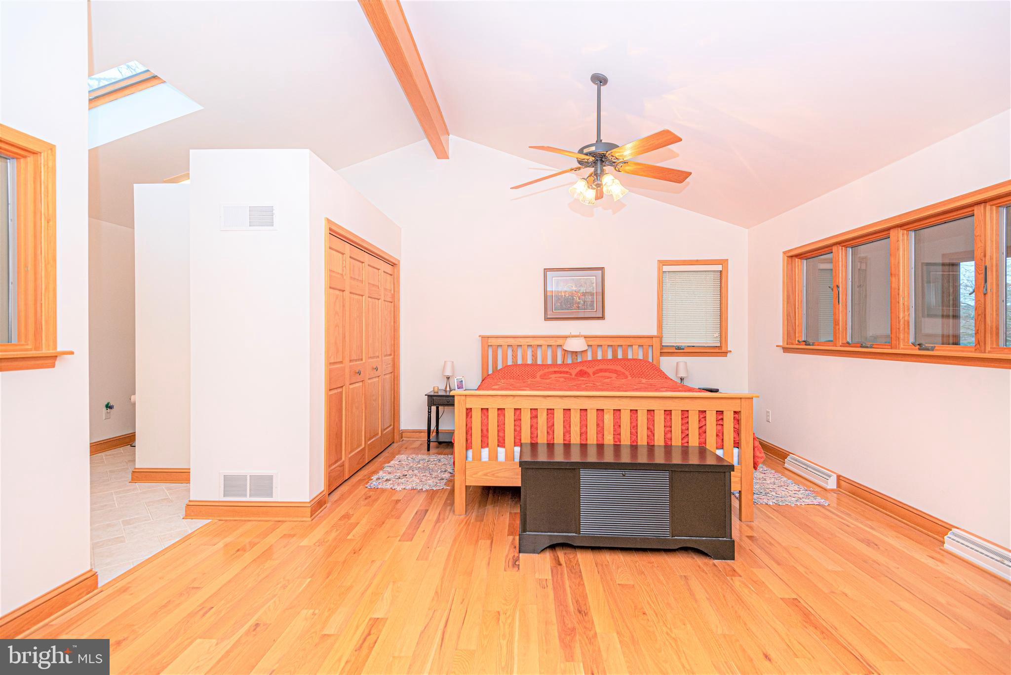 9434 Croppers Island Road Newark, MD 21841 - Photo 27 of 48 a bedroom with a bed and wooden floor