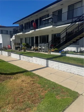 a view of a house with swimming pool and porch