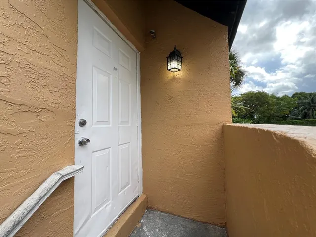 a view of balcony with wooden floor