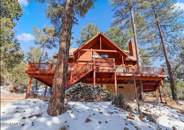 a front view of a house with table and chairs