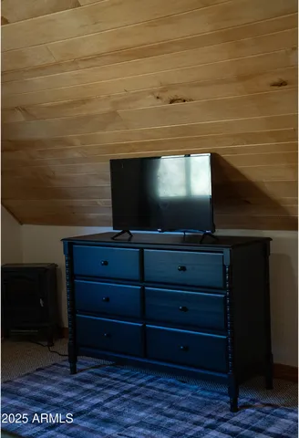 a living room with a flat screen tv