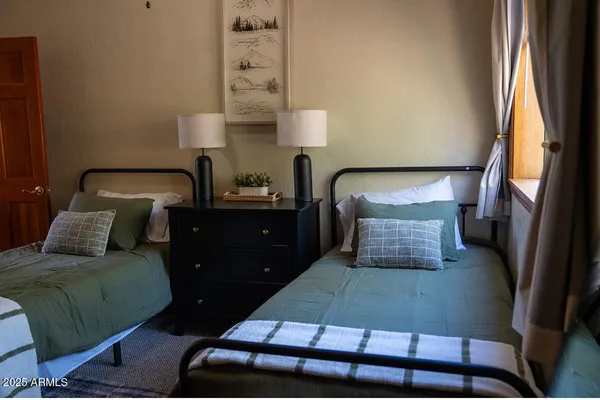 a room with a bed and a mirror