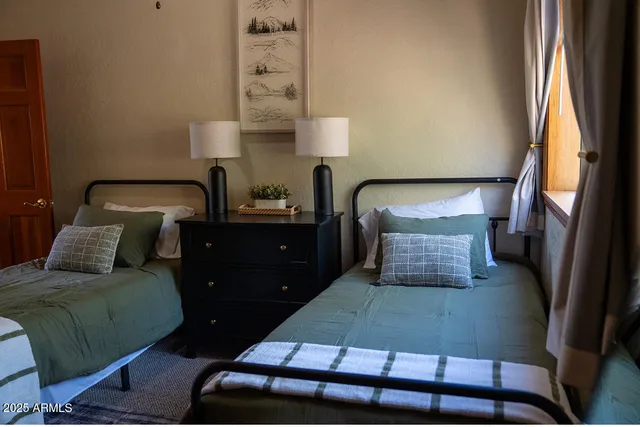 a room with a bed and a mirror