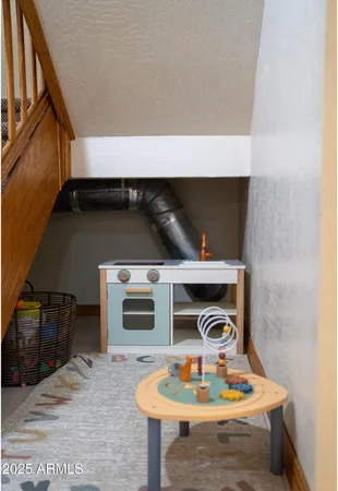 a stove top oven sitting inside of a kitchen