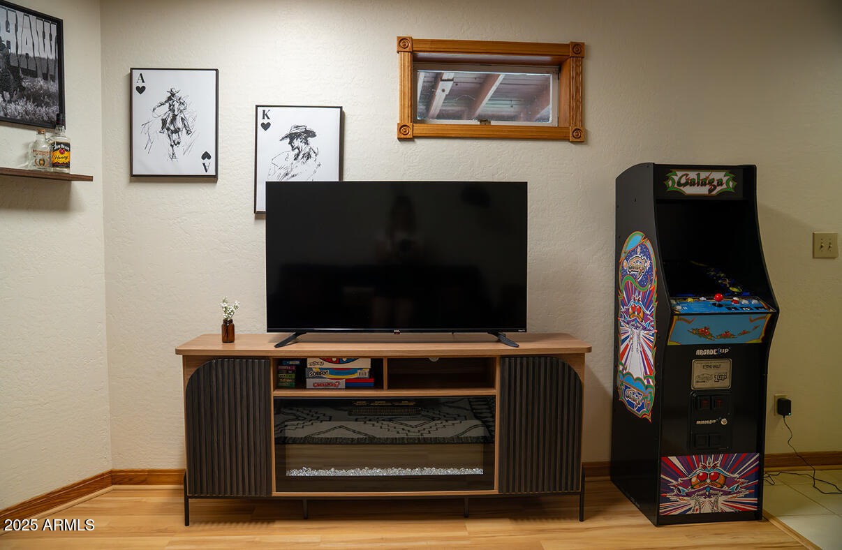 9651 Wild Turkey Lane Strawberry, AZ 85544 - Photo 37 of 41 a living room with furniture and a flat screen tv