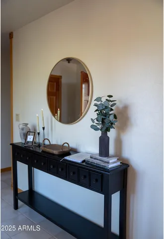 a view of a patio with table and chairs with wooden floor and fence