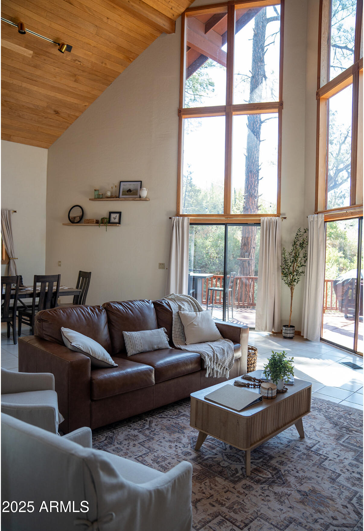 9651 Wild Turkey Lane Strawberry, AZ 85544 - Photo 10 of 41 a living room with furniture and a large window