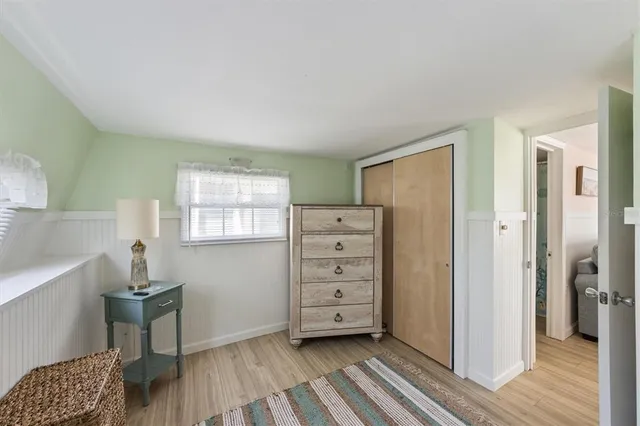 a view of room with furniture and wooden floor