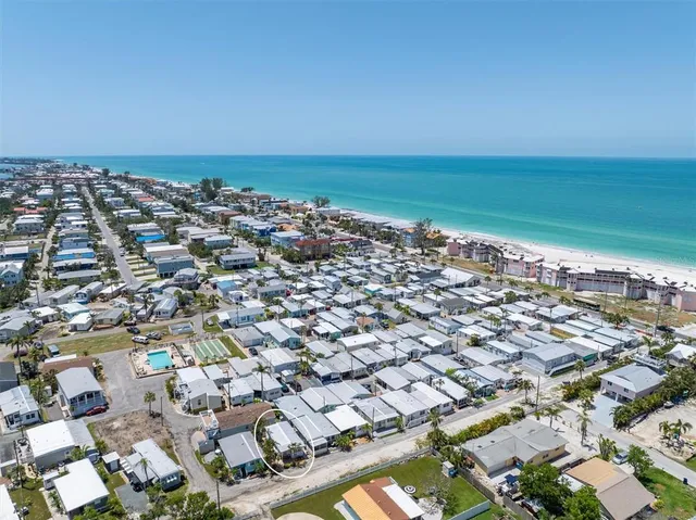 an aerial view of a city with ocean view