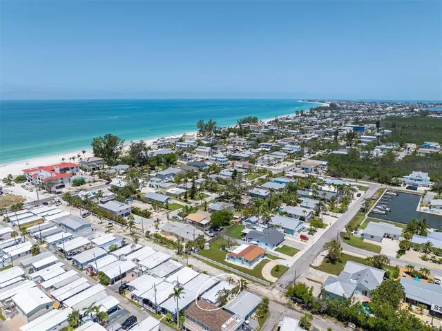 an aerial view of a city with ocean view