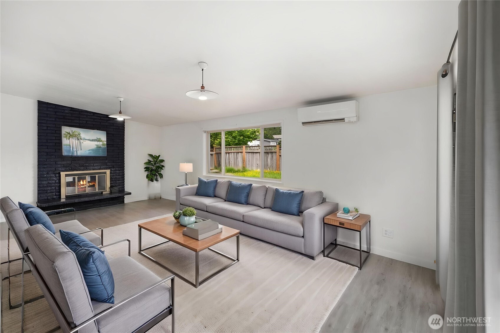 101 161st Street Southeast Bothell, WA 98012 - Photo 19 of 34 a living room with furniture and a fireplace