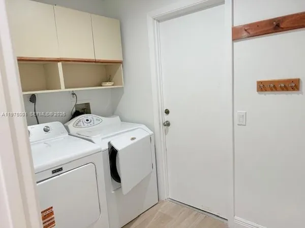 a utility room with dryer and washer