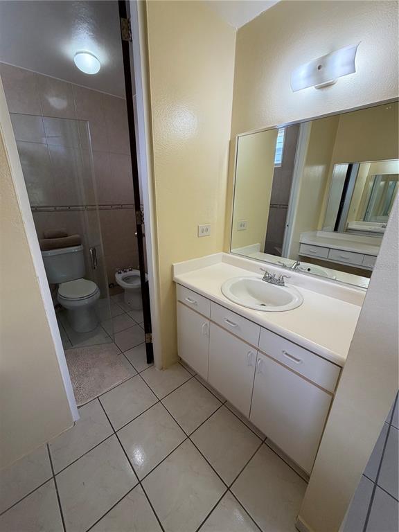 1 St Rio Grande, Unit B6 Rio Grande, PR 00745 - Photo 32 of 47 a bathroom with a sink a toilet and mirror