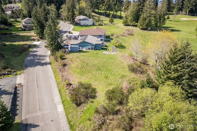 an aerial view of residential house with beach