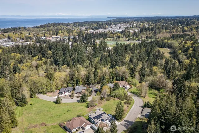 a view of a house with a mountain in the background