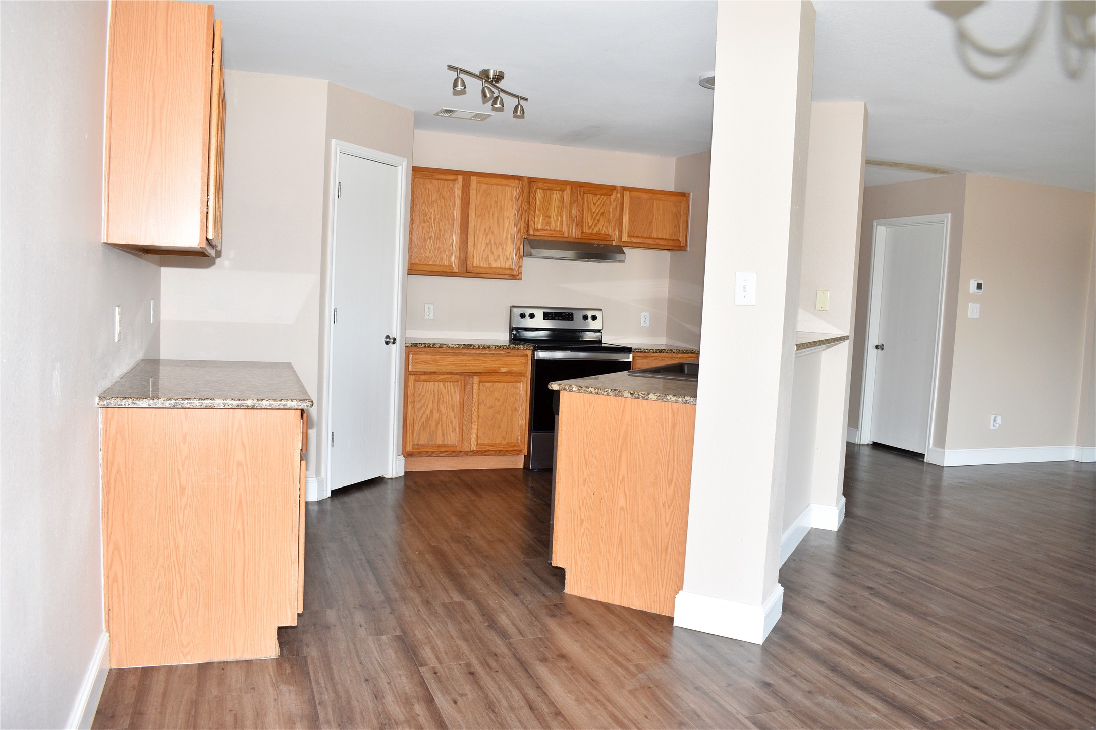 804 Lavaca Loop Elgin, TX 78621 - Photo 6 of 11 Kitchen with electric range and walk in pantry