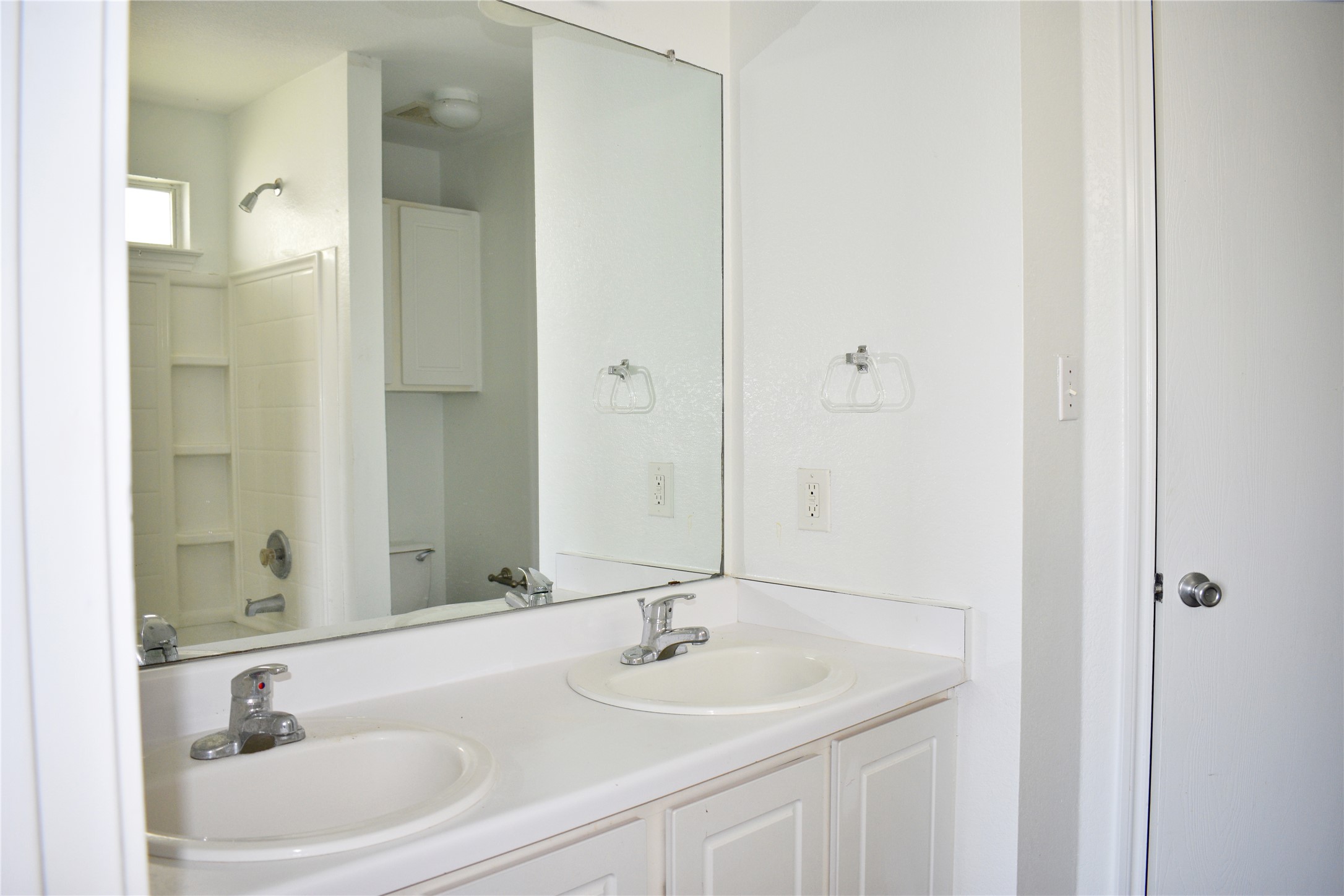 804 Lavaca Loop Elgin, TX 78621 - Photo 9 of 11 Primary Bathroom with double vanity and shower / tub combination and walk in closet