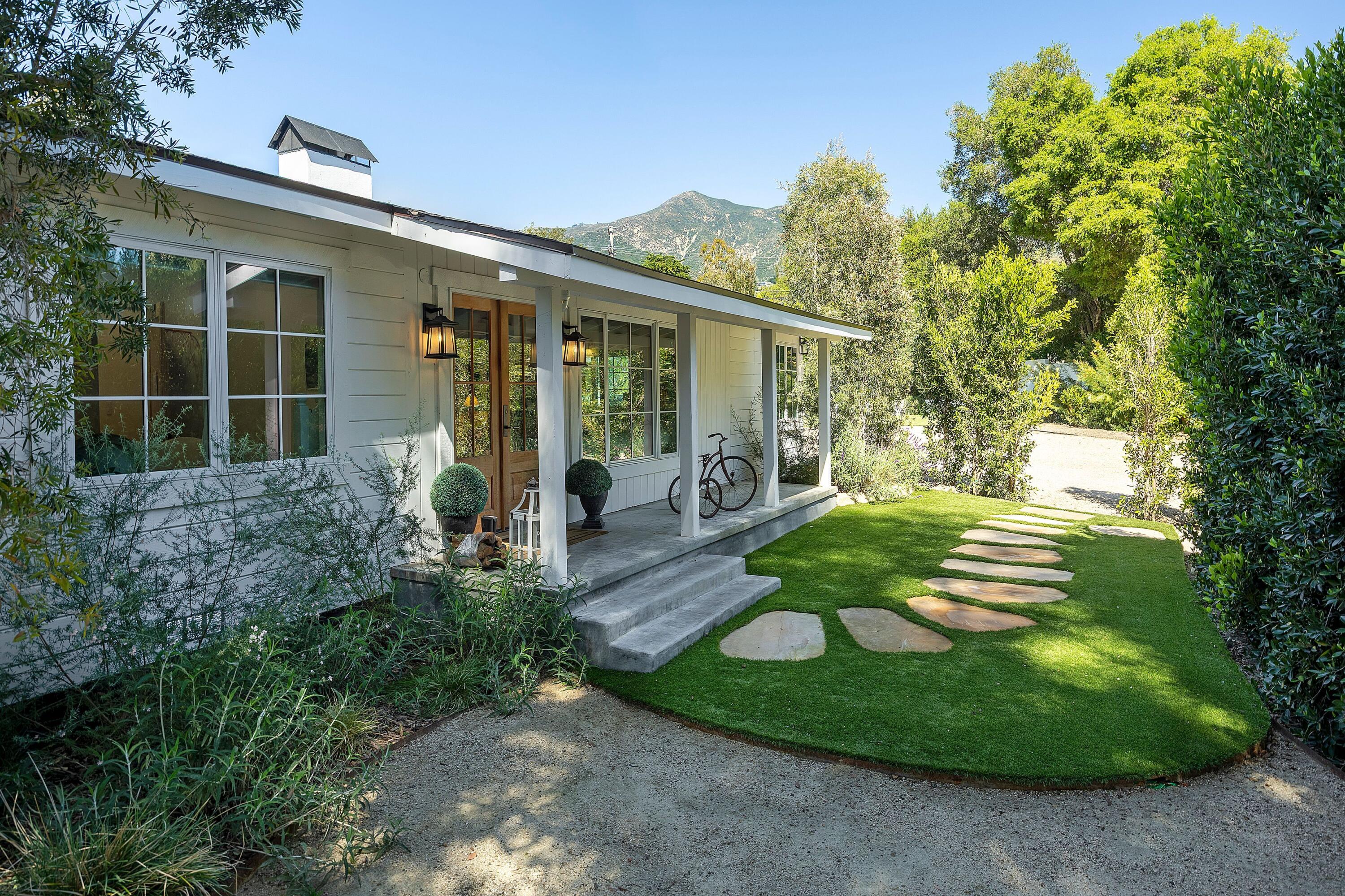 487 Hot Springs Road Santa Barbara, CA 93108 - Photo 2 of 47 a view of a house with backyard garden and sitting area