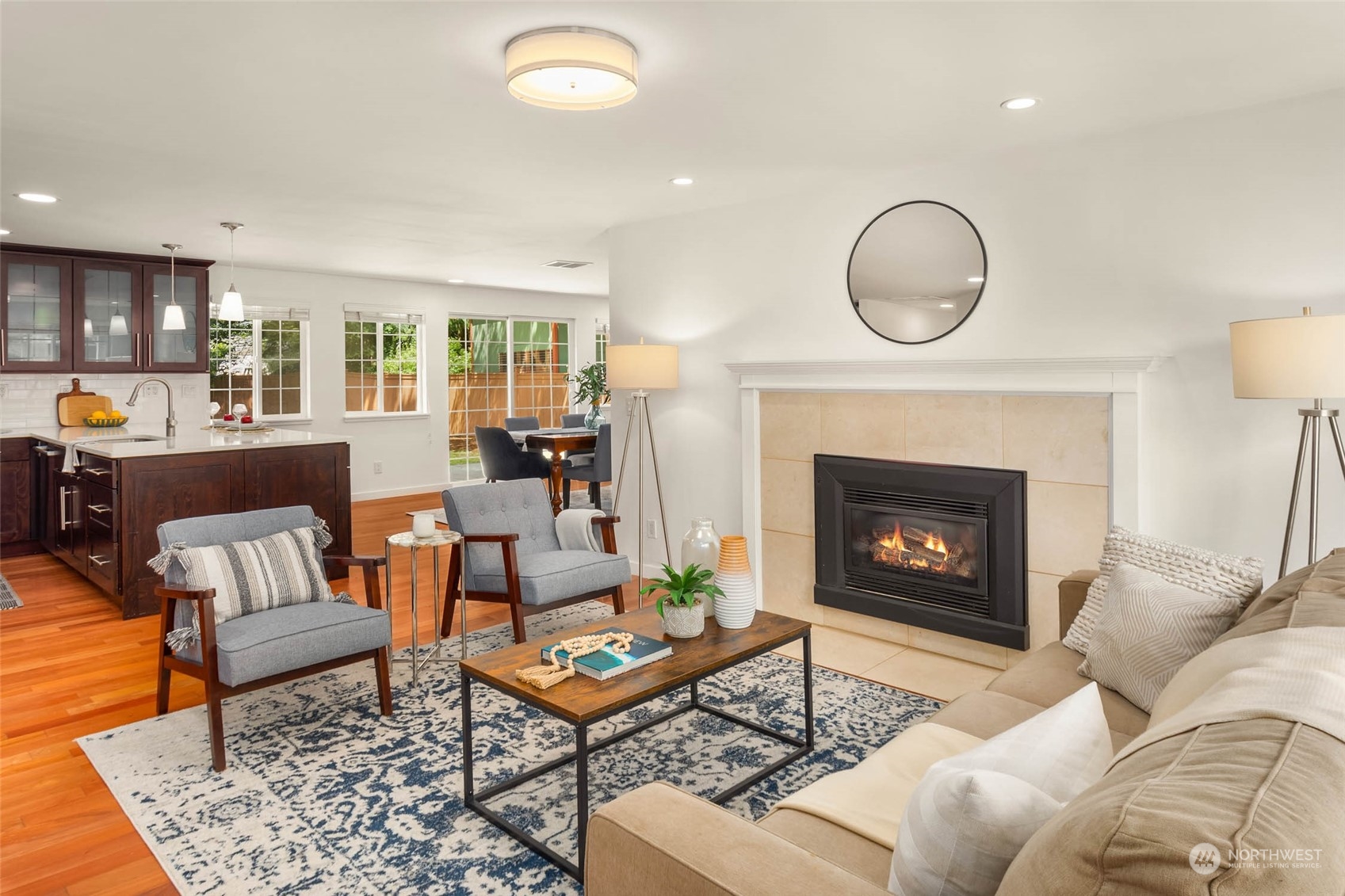 4200 Northeast 19th Street Renton, WA 98059 - Photo 13 of 25 a living room with furniture a rug a fireplace and a large window