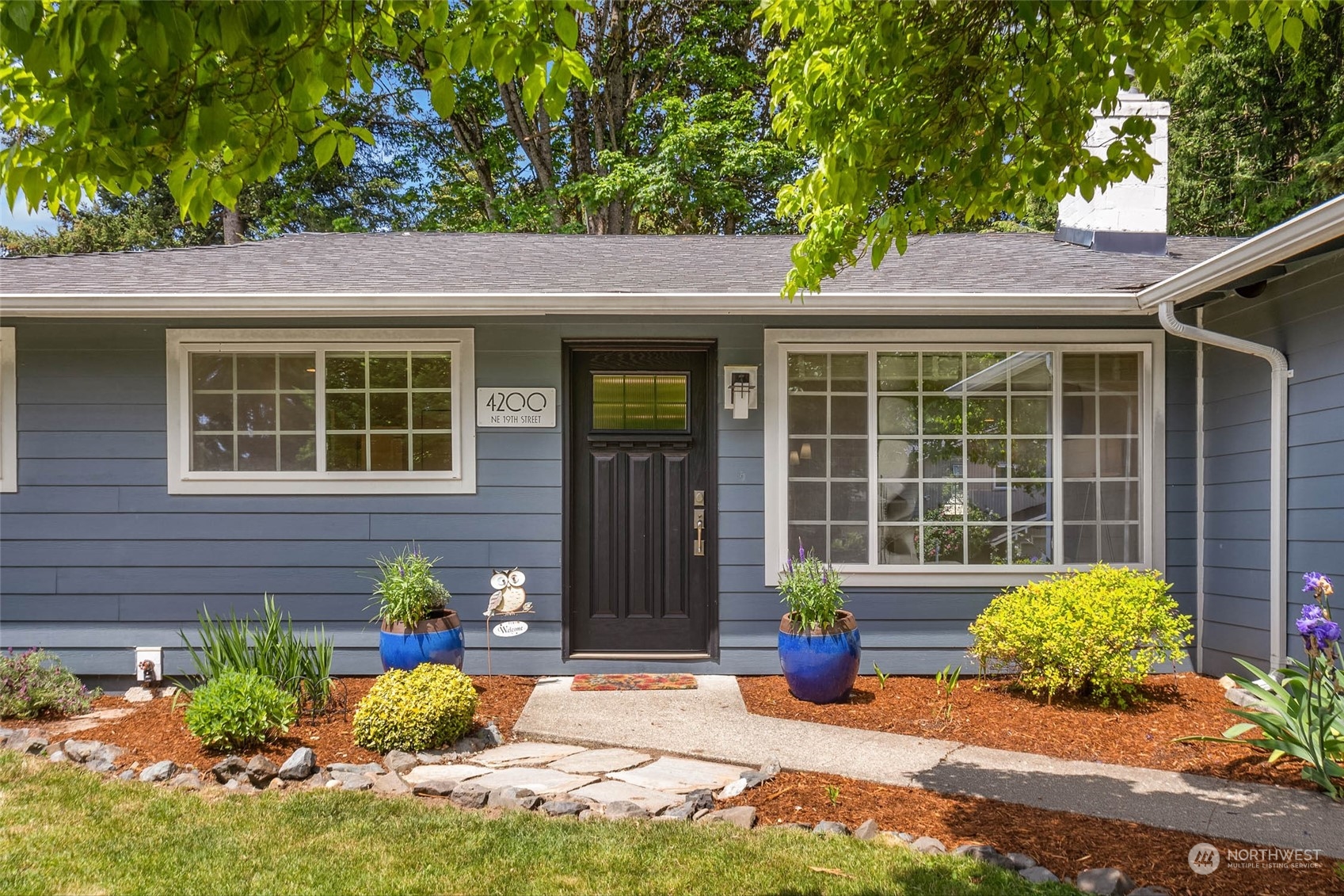 4200 Northeast 19th Street Renton, WA 98059 - Photo 2 of 25 a front view of a house with garden