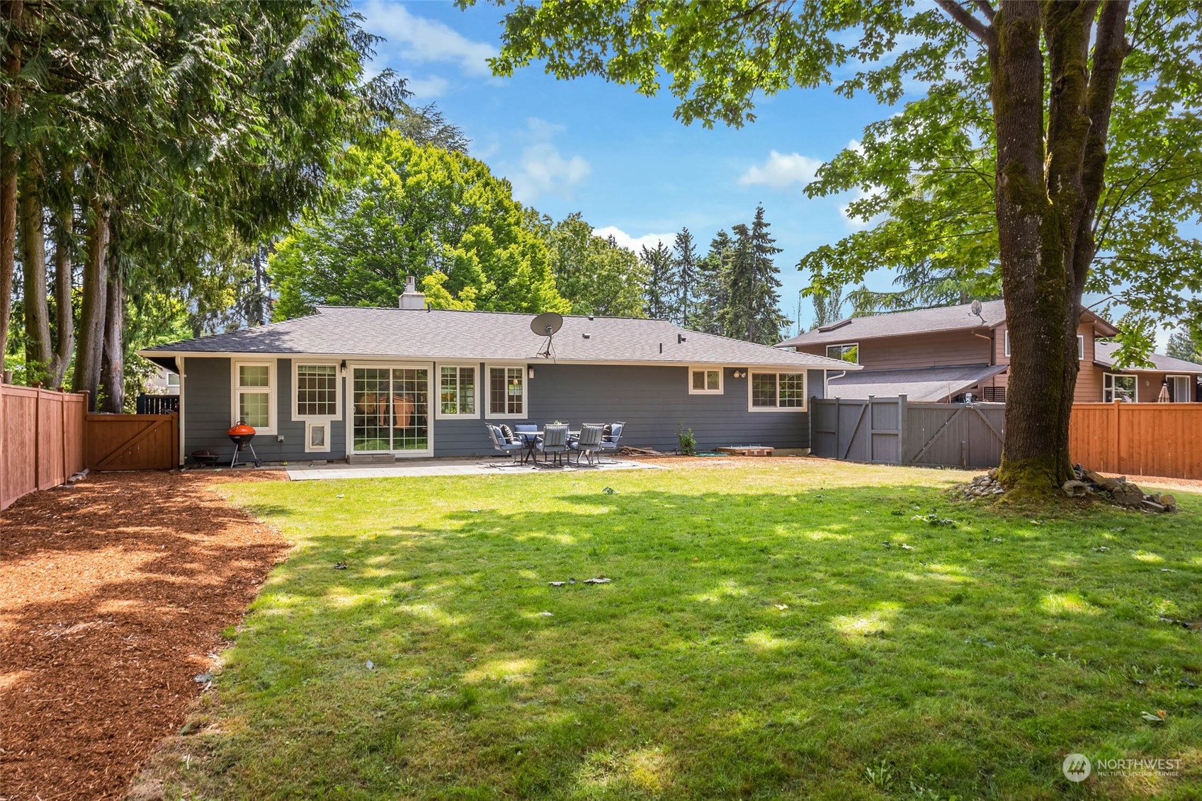 4200 Northeast 19th Street Renton, WA 98059 - Photo 3 of 25 a front view of a house with a yard