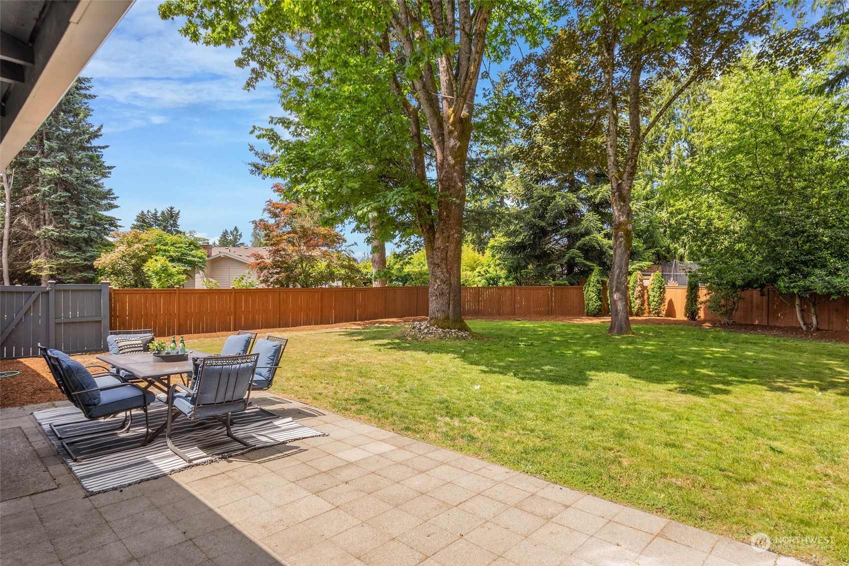 4200 Northeast 19th Street Renton, WA 98059 - Photo 4 of 25 a view of a patio with a table and chairs