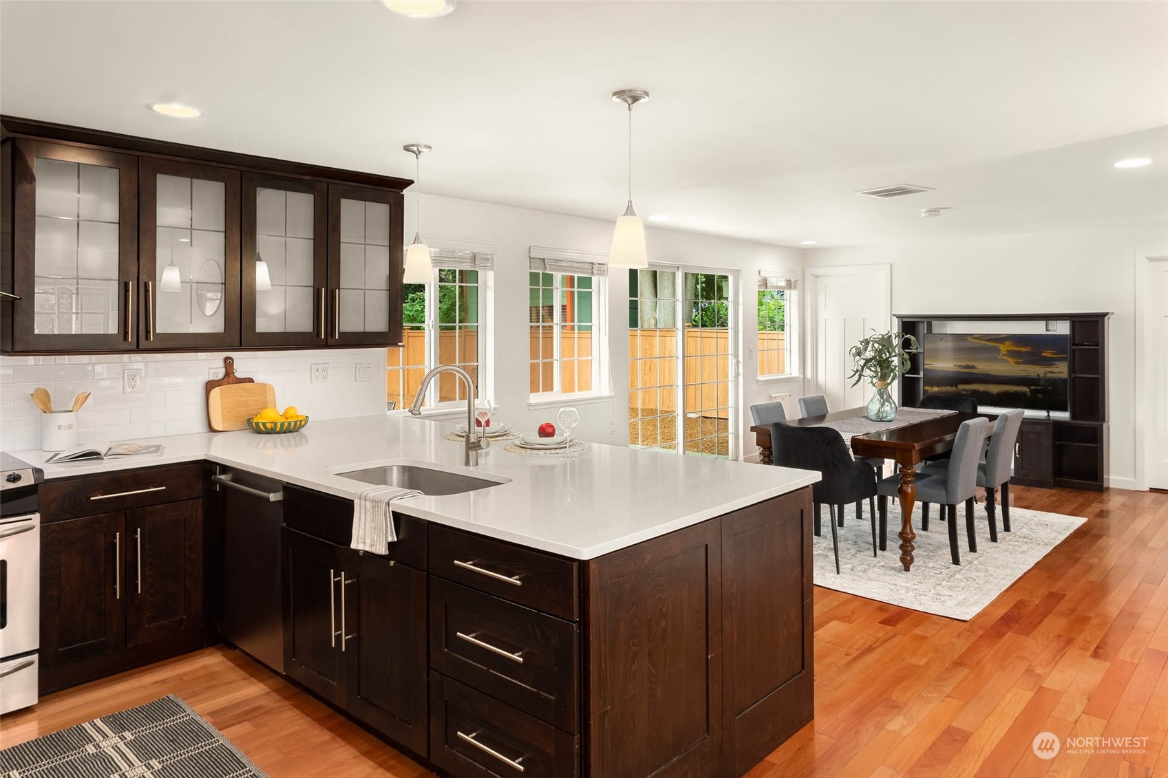 4200 Northeast 19th Street Renton, WA 98059 - Photo 10 of 25 a kitchen with a sink and wooden cabinets