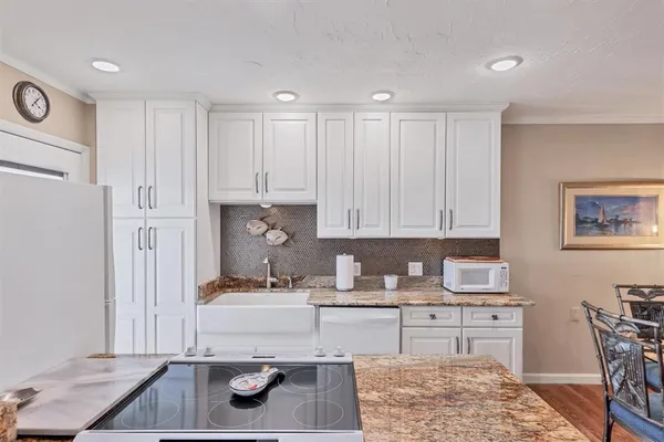 a kitchen with a sink and cabinets