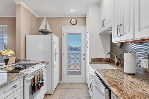 a kitchen with a stove and a sink