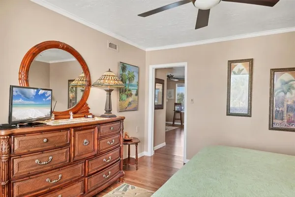 a view of room with furniture and wooden floor