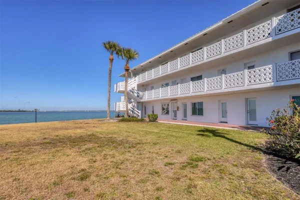 a view of a building with a yard