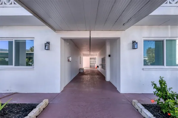a view of a hallway with windows
