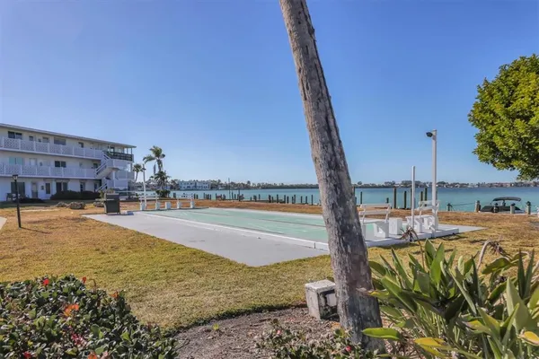 a view of a swimming pool with a lawn chairs
