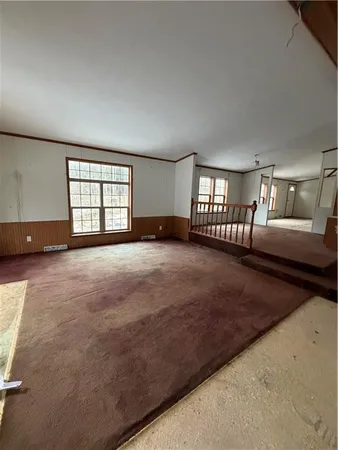 a view of an empty room and window