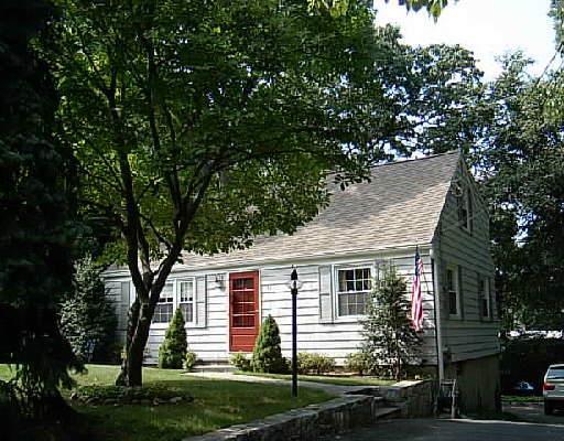 front view of a house with a yard