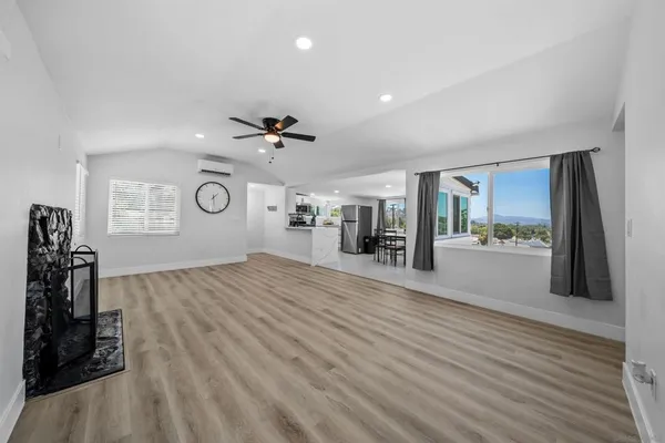 a view of a living room and hardwood floor