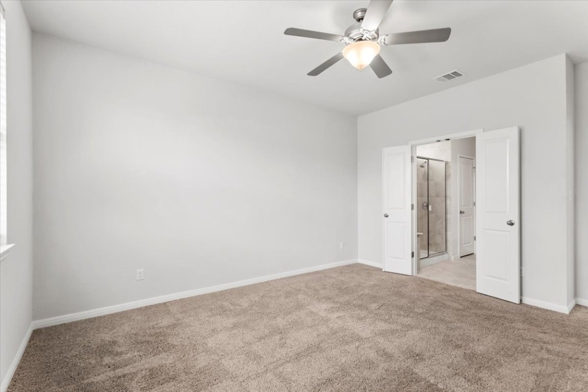 105 Otella Street Georgetown, TX 78628 - Photo 14 of 31 a view of a big room with a ceiling fan and a ceiling fan