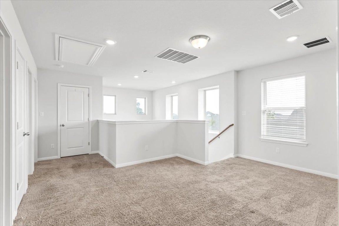 105 Otella Street Georgetown, TX 78628 - Photo 19 of 31 a view of an empty room with a window