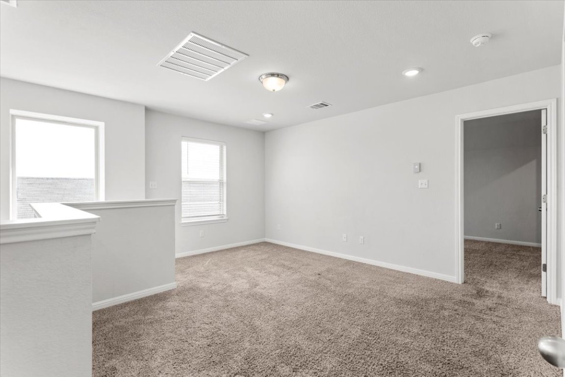 105 Otella Street Georgetown, TX 78628 - Photo 20 of 31 a view of an empty room with a window