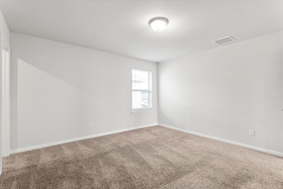 105 Otella Street Georgetown, TX 78628 - Photo 24 of 31 an empty room with a window