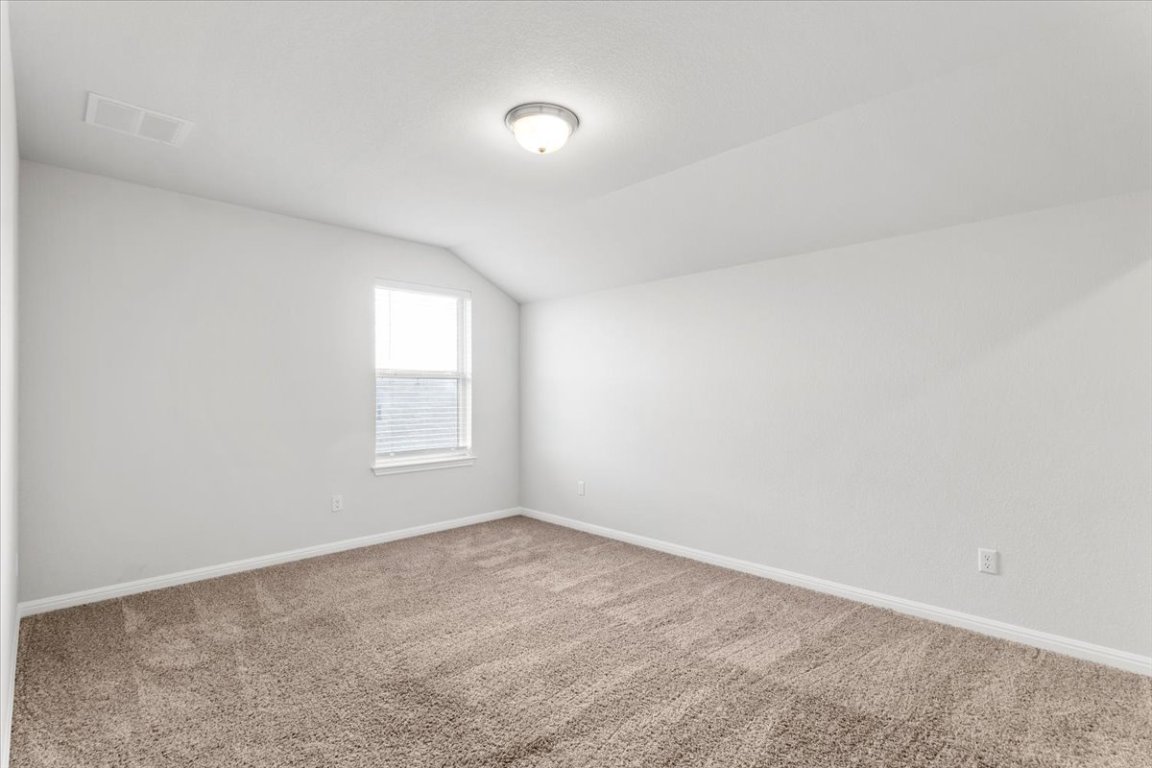 105 Otella Street Georgetown, TX 78628 - Photo 26 of 31 a view of an empty room and window