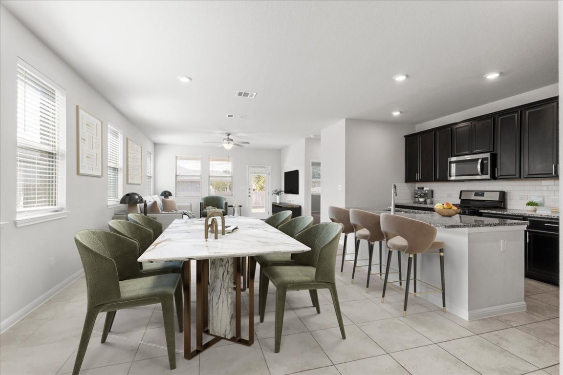 105 Otella Street Georgetown, TX 78628 - Photo 10 of 31 a view of a dining room with furniture