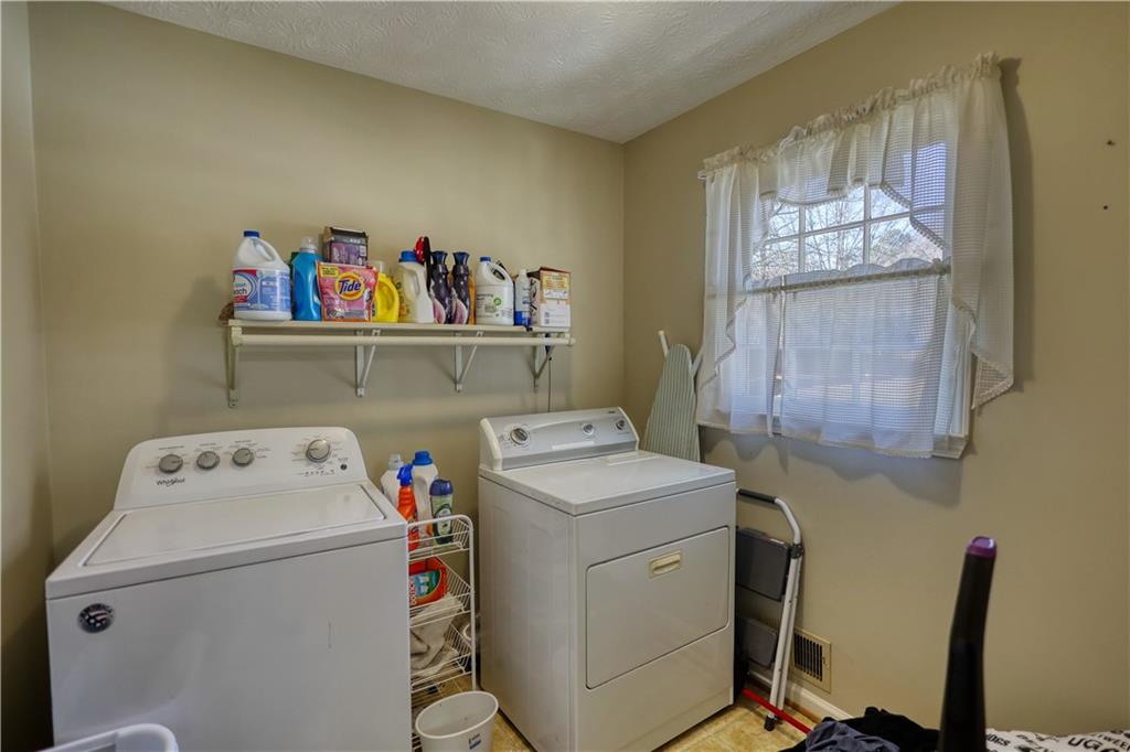 12510 Highway 36 Covington, GA 30014 - Photo 13 of 31 a utility room with dryer and washer