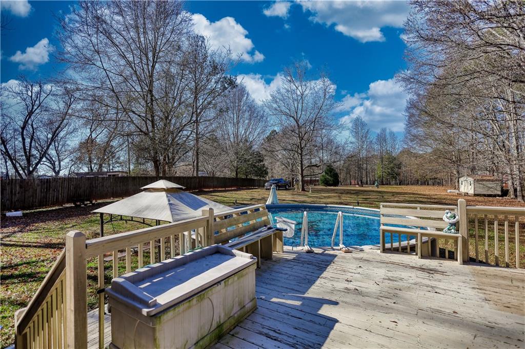 12510 Highway 36 Covington, GA 30014 - Photo 22 of 31 a view of a deck with furniture and wooden fence